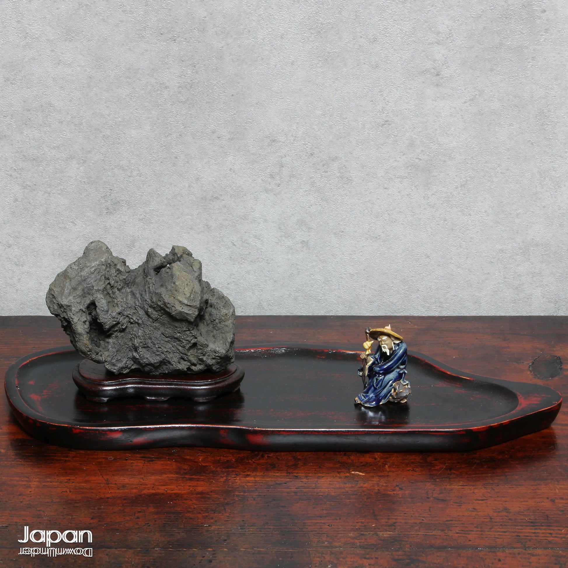 Infuse your interior with the quiet power of nature through this evocative vintage Japanese suiseki. Cradled on a finely hand-carved wooden daiza (stand), this stone exudes a meditative stillness - an ideal focal point for spaces designed for reflection, mindfulness, or artistic appreciation.