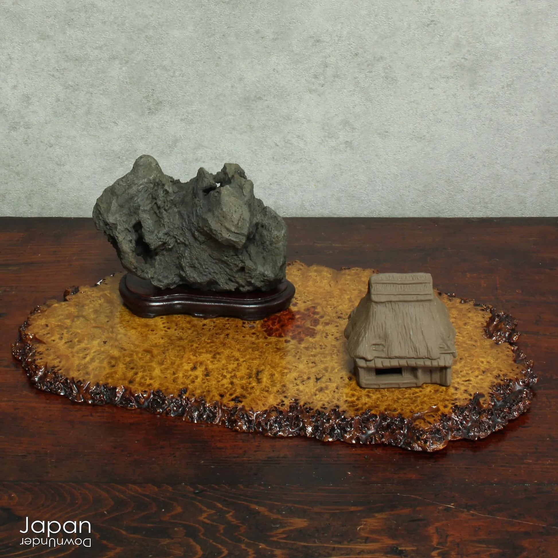 Infuse your interior with the quiet power of nature through this evocative vintage Japanese suiseki. Cradled on a finely hand-carved wooden daiza (stand), this stone exudes a meditative stillness - an ideal focal point for spaces designed for reflection, mindfulness, or artistic appreciation.