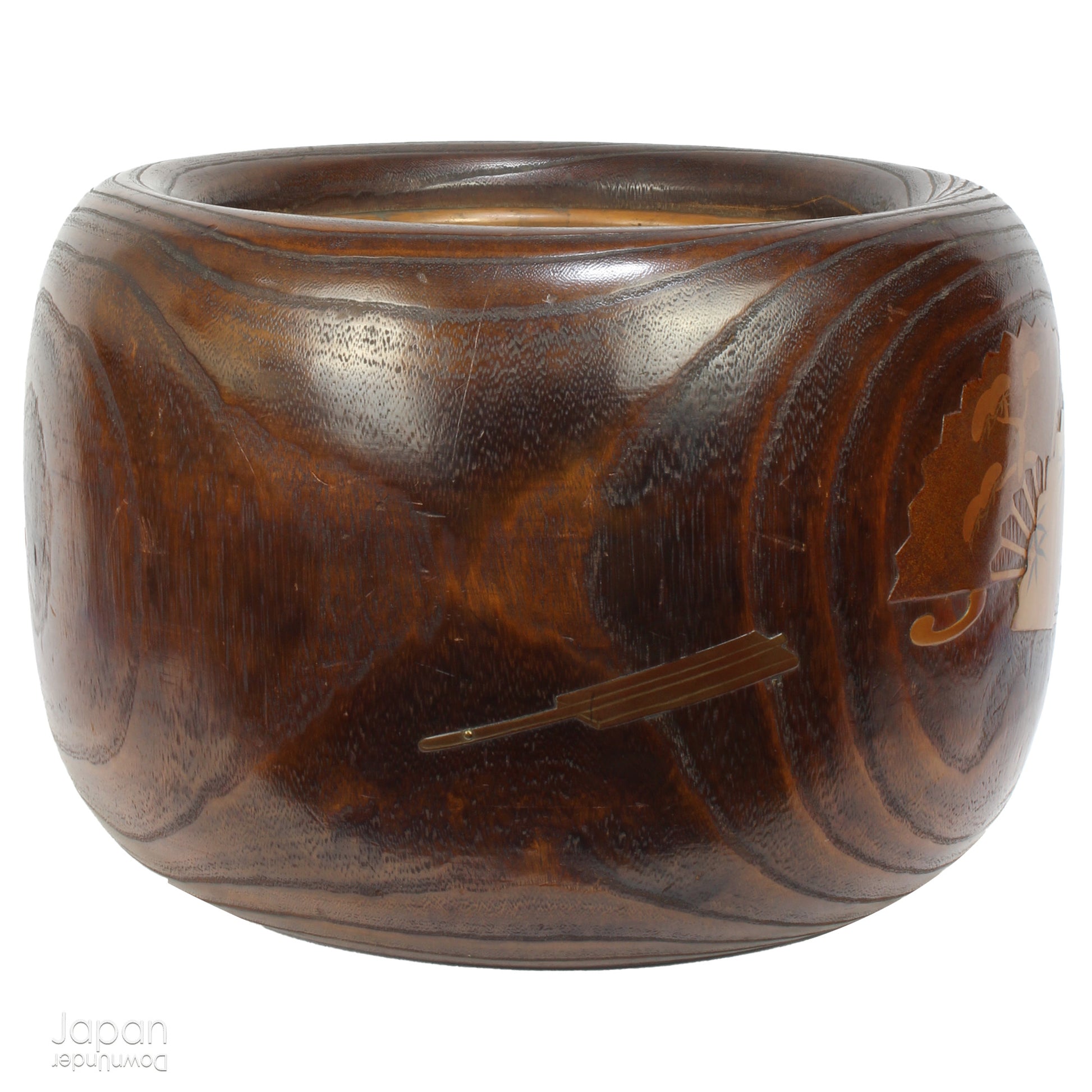 Infuse your home with the charm of Japanese tradition with this stunning antique hibachi heating pot. Adorned with intricate gold makie lacquer fans, this lovely piece seamlessly blends artistry and functionality, making it perfect as a decorative object, vase, or planter. A rare and beautiful find for those who appreciate vintage decor with a touch of elegance and history.