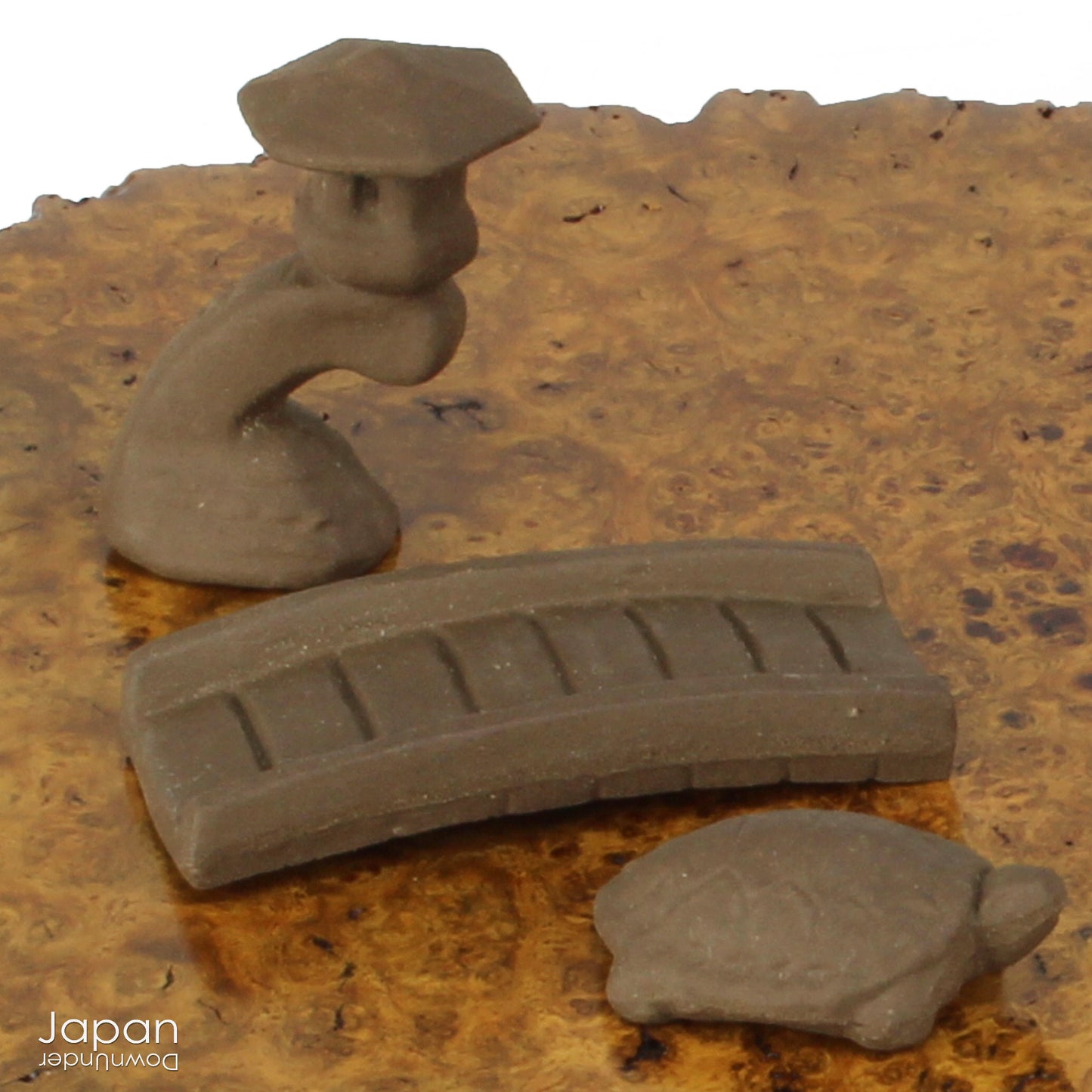 Bring your bonsai and suiseki presentations to life with this charming collection of vintage Japanese ceramic miniatures. Known as tenkei or tenpai, these small accessory pieces are traditionally used to create scale, evoke atmosphere, and infuse scenes with storytelling and imagination.