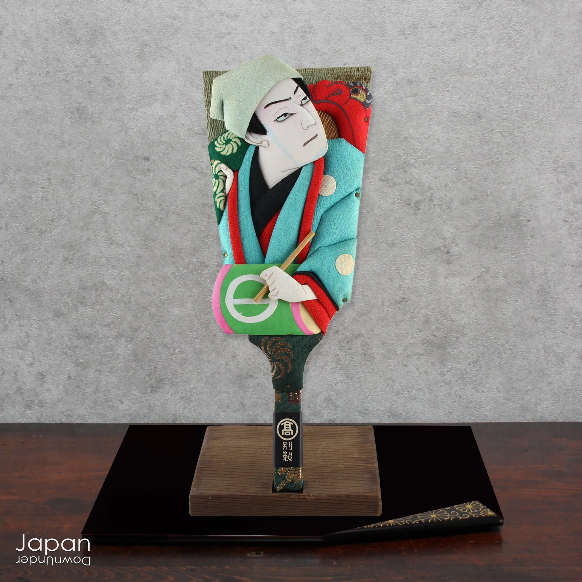 The hagoita has deep roots in Japanese New Year customs. Originally used in the game of hanetsuki - similar to badminton but played without a net - these paddles became symbolic protectors, their swift motion believed to dispel negative energy, much like the ceremonial gestures of a Shinto priest.