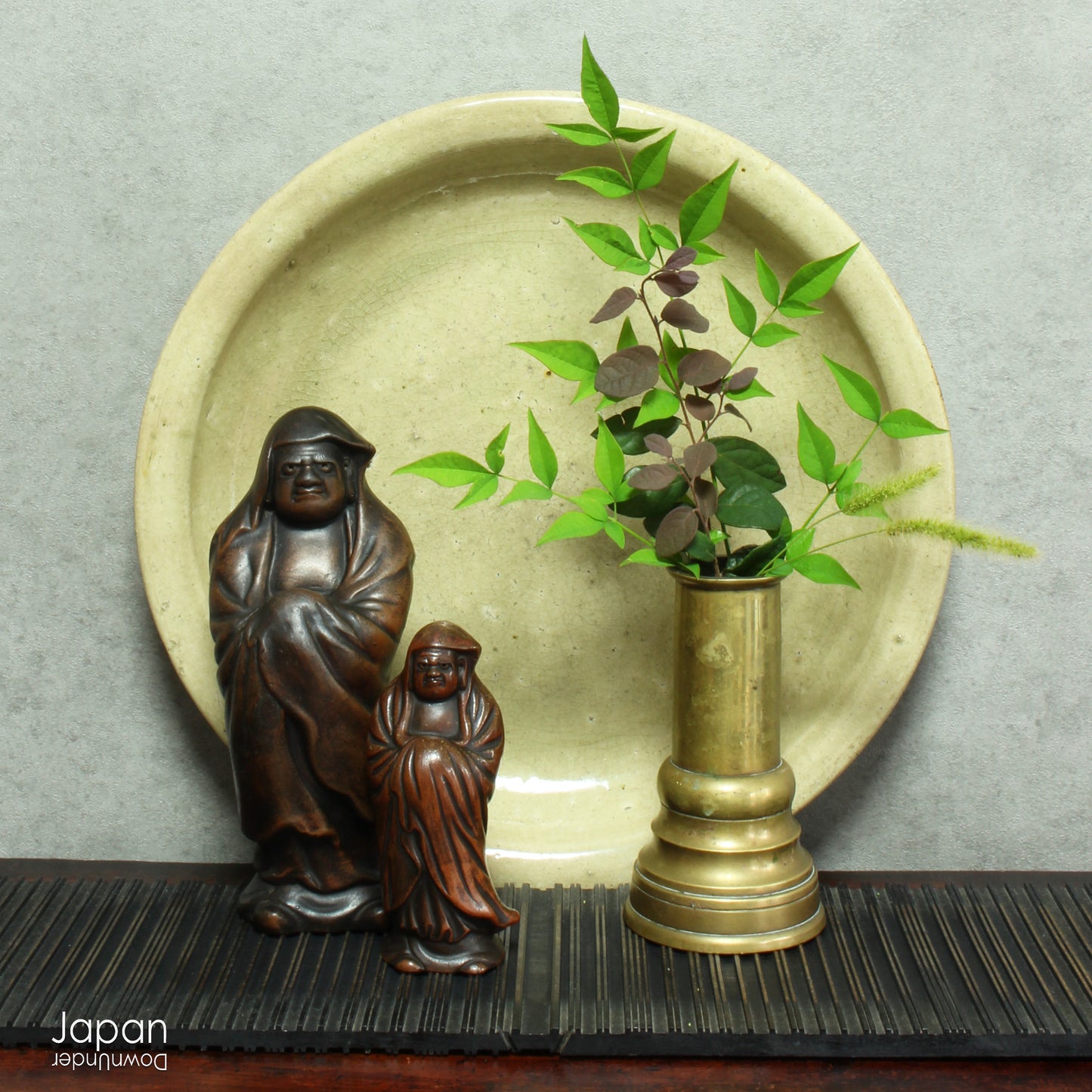 Step into a world of history and artistry with this stunning antique folk art large stoneware serving plate. A true vintage treasure, this piece offers a rare glimpse into the artistry of the Edo and Meiji eras, capturing the essence of a bygone time.