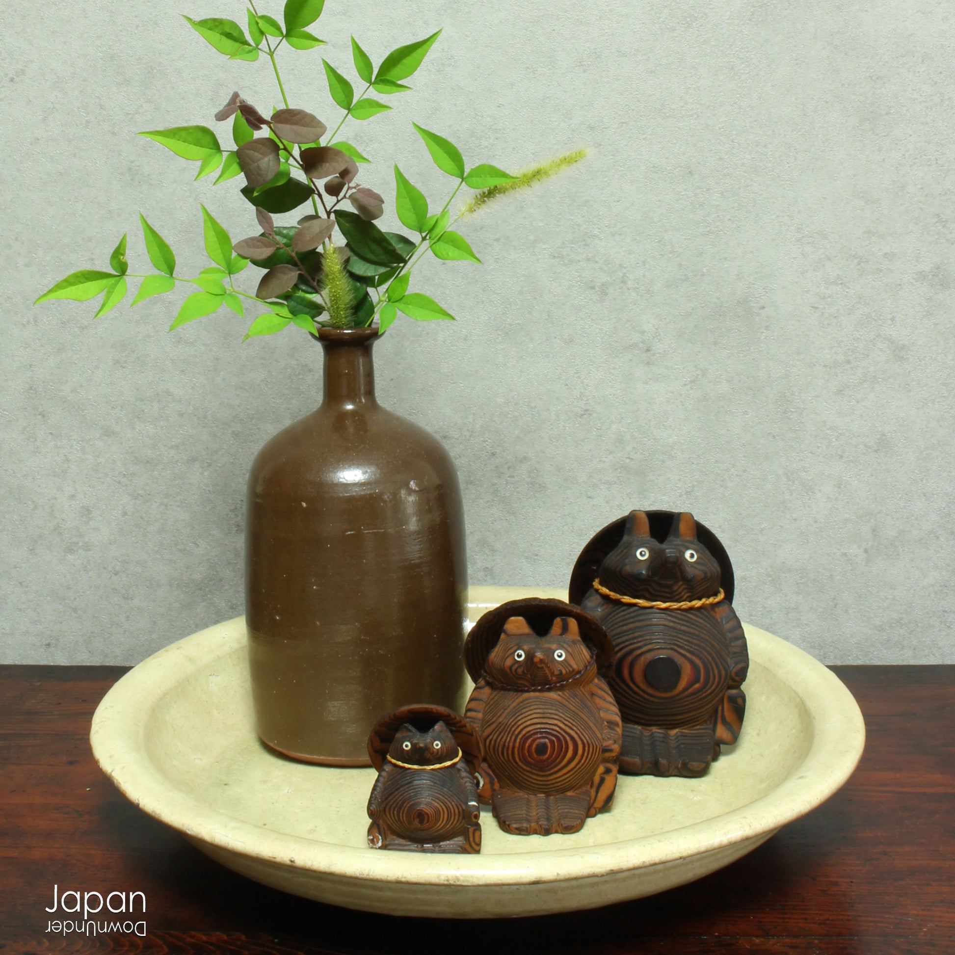 Step into a world of history and artistry with this stunning antique folk art large stoneware serving plate. A true vintage treasure, this piece offers a rare glimpse into the artistry of the Edo and Meiji eras, capturing the essence of a bygone time.