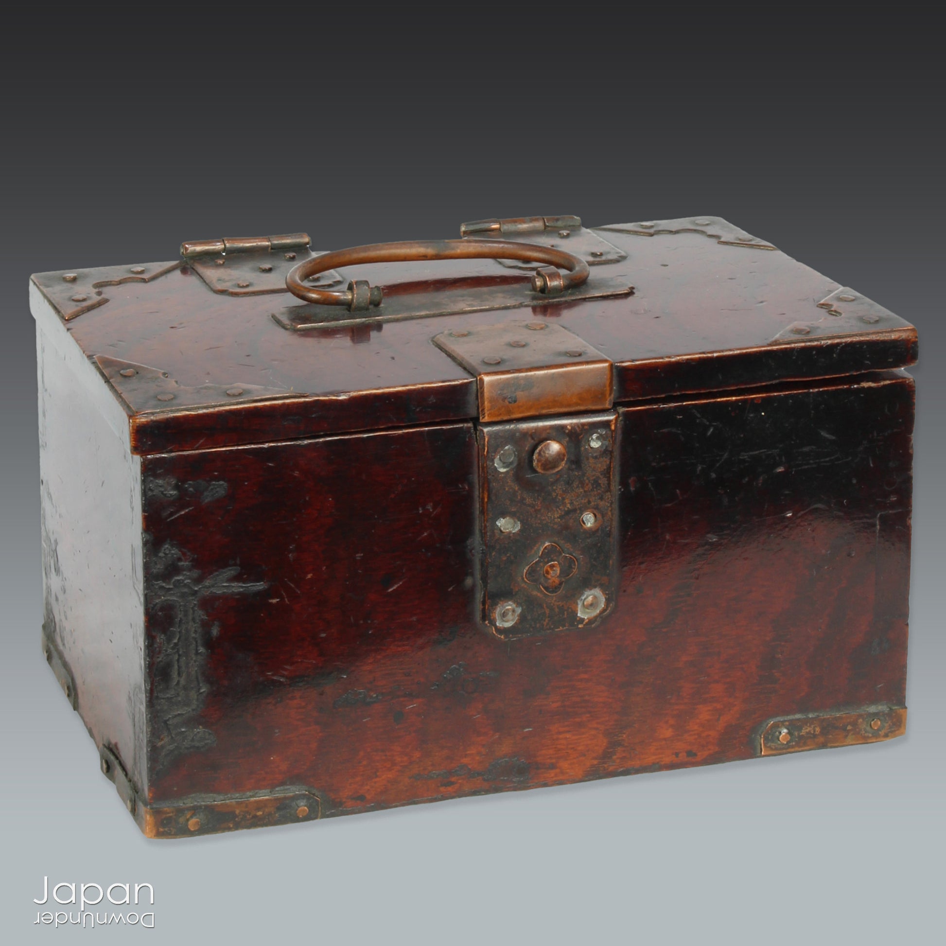 Discover a rare and beautifully aged treasure from the Meiji era (late 1800s) - a small Japanese wooden box that perfectly marries rustic charm with quiet sophistication. Originally designed with purpose and practicality at its core, this piece offers both functional storage and an understated aesthetic appeal, making it an ideal home for your cherished keepsakes or a striking accent in any space.
