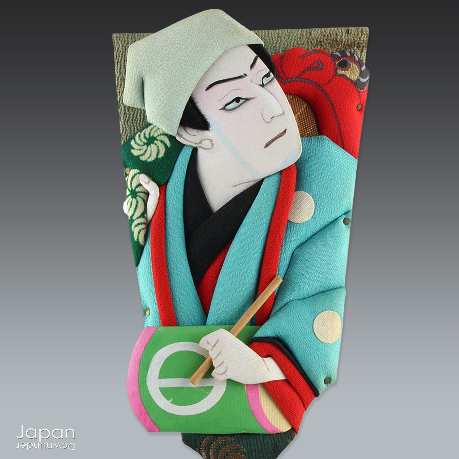 The hagoita has deep roots in Japanese New Year customs. Originally used in the game of hanetsuki - similar to badminton but played without a net - these paddles became symbolic protectors, their swift motion believed to dispel negative energy, much like the ceremonial gestures of a Shinto priest.