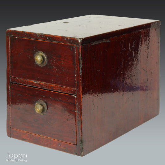 Discover the quiet charm of this petite Taisho era Japanese lacquered wood box - a piece that blends humble functionality with an understated elegance. Designed for storing your most cherished small items, it brings a subtle touch of folk artistry to any setting while offering a truly storied way to organize and display.