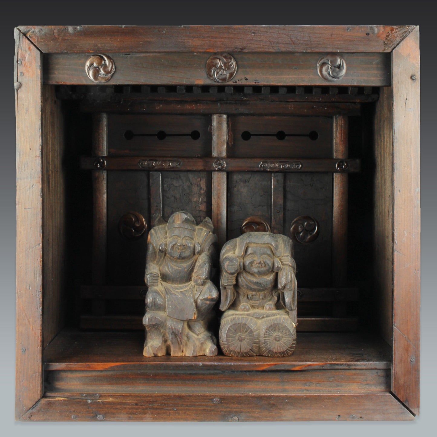Bring a piece of history into your home with this rare 1800's Shinto folk faith shrine, perfect for creating a sacred space on your own god shelf or within your home. This antique religious decor piece includes the lucky gods, Ebisu and Daikoku.