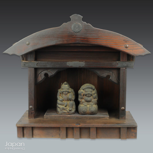 A perfect addition to your spiritual space, this rustic antique Shinto shrine, made to be placed on the kamidana (god shelf), houses the lucky god Ebisu and Daikoku. This charming hand crafted god house embodies the essence of Shinto folk faith.