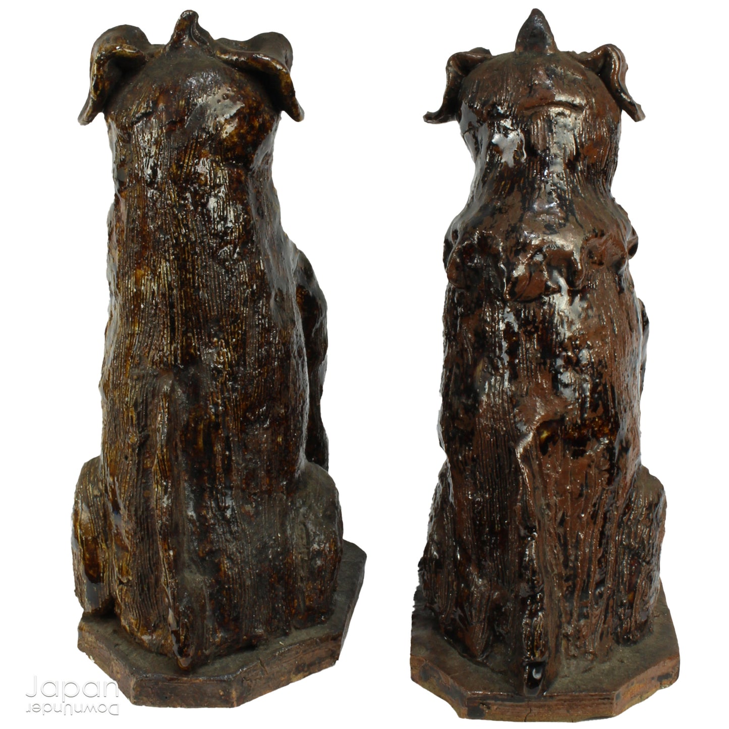 An enchanting duo of antique stoneware lion dogs, known as komainu. Believed to ward off evil, these guardians stand watch at the entrance of Shinto shrines, and will add a touch of mystique to your decor. Handcrafted with intricate details, the lion dogs are sure to bring a sense of protection and tradition to your space.