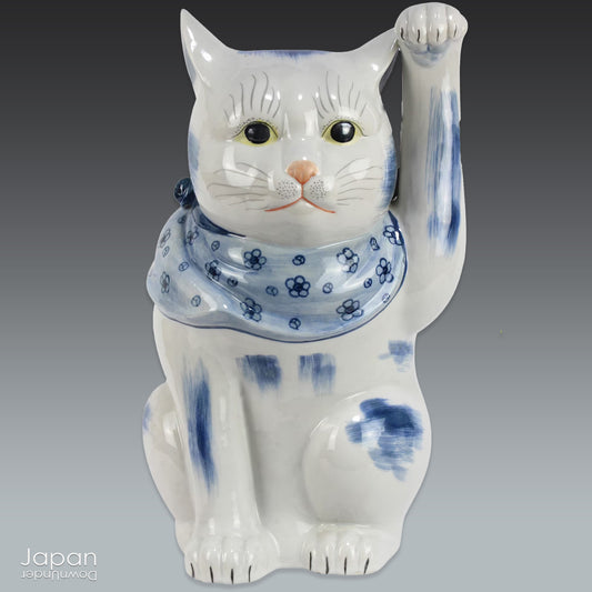 Bring an aura of good fortune and opulence into your space with this stunning large and heavy black Kutani pottery maneki neko cat. This beautiful piece beckons in good luck and wealth, exuding a sense of simple elegance that is truly striking. A must-have for those seeking to add a touch of charm and prosperity to their decor.