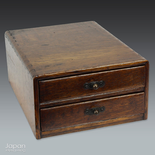 Step into the quiet charm of Japan’s Taisho era with this petite lacquered wood box - a beautifully understated piece that fuses functional design with timeless elegance. Once a humble item of office furniture, it now makes a distinctive decorative accent in the modern home.