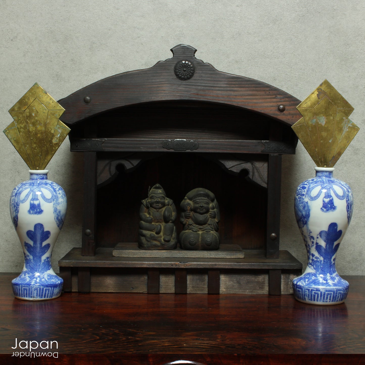 A perfect addition to your spiritual space, this rustic antique Shinto shrine, made to be placed on the kamidana (god shelf), houses the lucky god Ebisu and Daikoku. This charming hand crafted god house embodies the essence of Shinto folk faith.