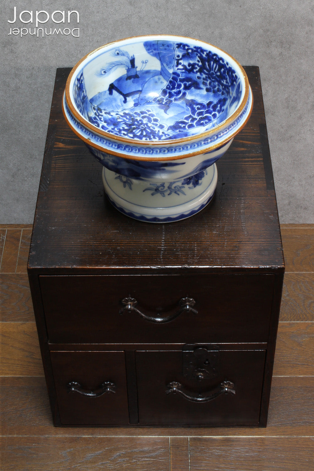 Elevate your home decor with this stunning antique blue and white Imari bowl on a stand. This rare and elegant piece features intricate hand-painted designs, both inside and out, showcasing craftsmanship that will captivate and enchant. Add a touch of sophistication and timeless beauty to any space with this exceptional treasure.