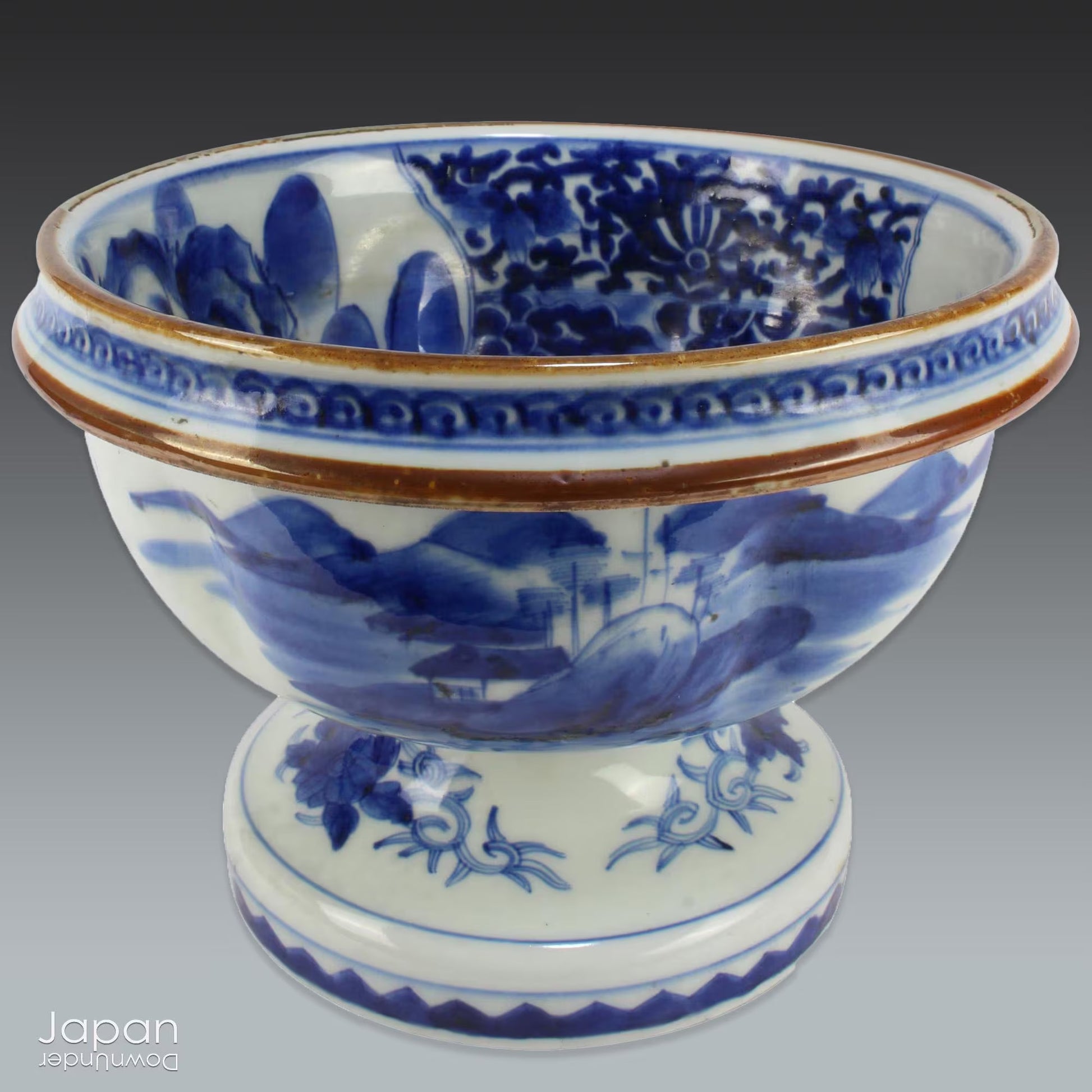 Elevate your home decor with this stunning antique blue and white Imari bowl on a stand. This rare and elegant piece features intricate hand-painted designs, both inside and out, showcasing craftsmanship that will captivate and enchant. Add a touch of sophistication and timeless beauty to any space with this exceptional treasure.