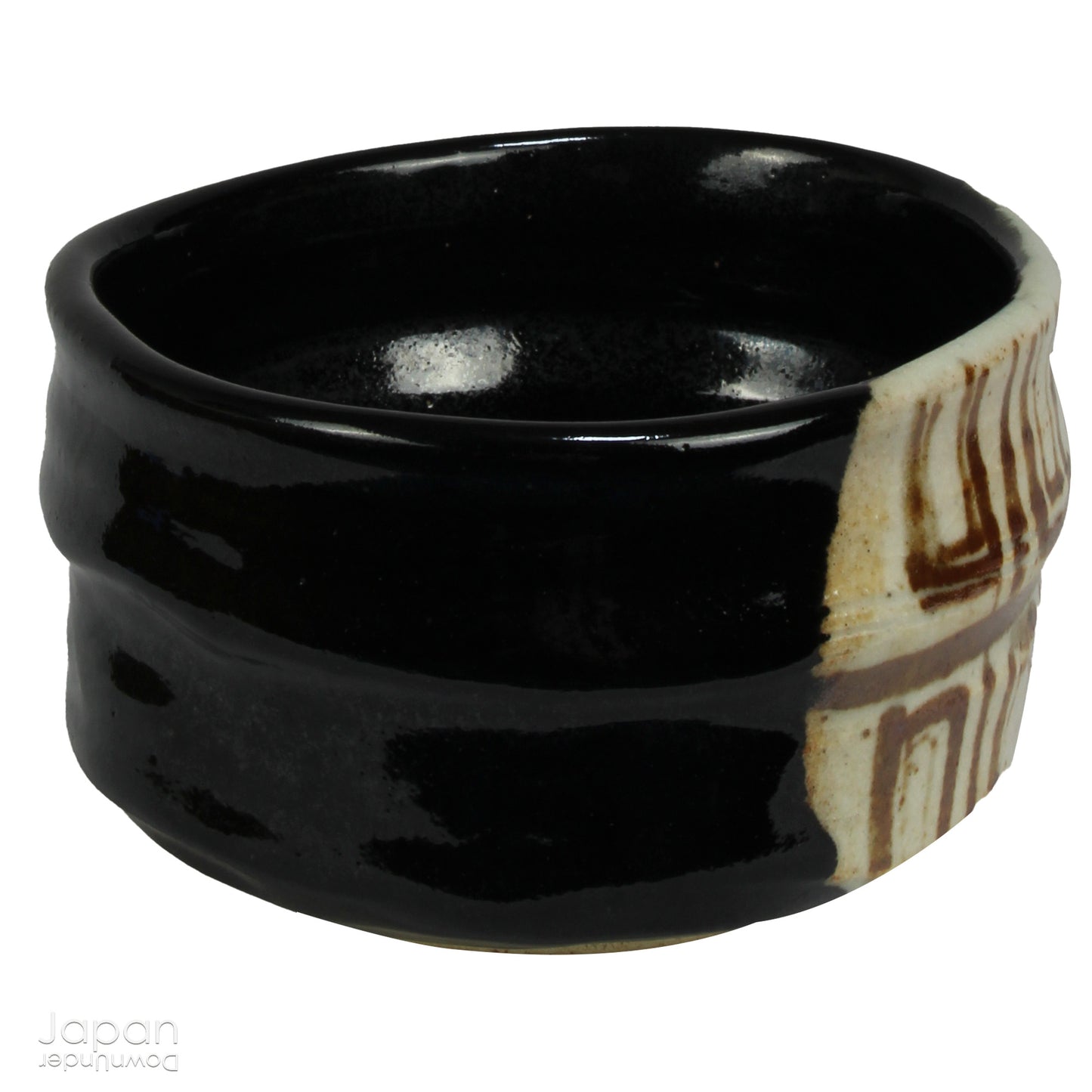 Experience the perfect blend of tradition and modernity with this stunning black Oribe matcha tea bowl. Crafted by the talented artist Yoshiyuki Sone, this unique piece boasts a contemporary design with a striking brown and beige geometric accent that adds a touch of sophistication to any tea ceremony.
The glossy black glaze of the bowl, paired with a minimalistic rectangular design, creates a striking contrast against the vibrant green matcha, making each sip feel even more special. True to the Oribe styl