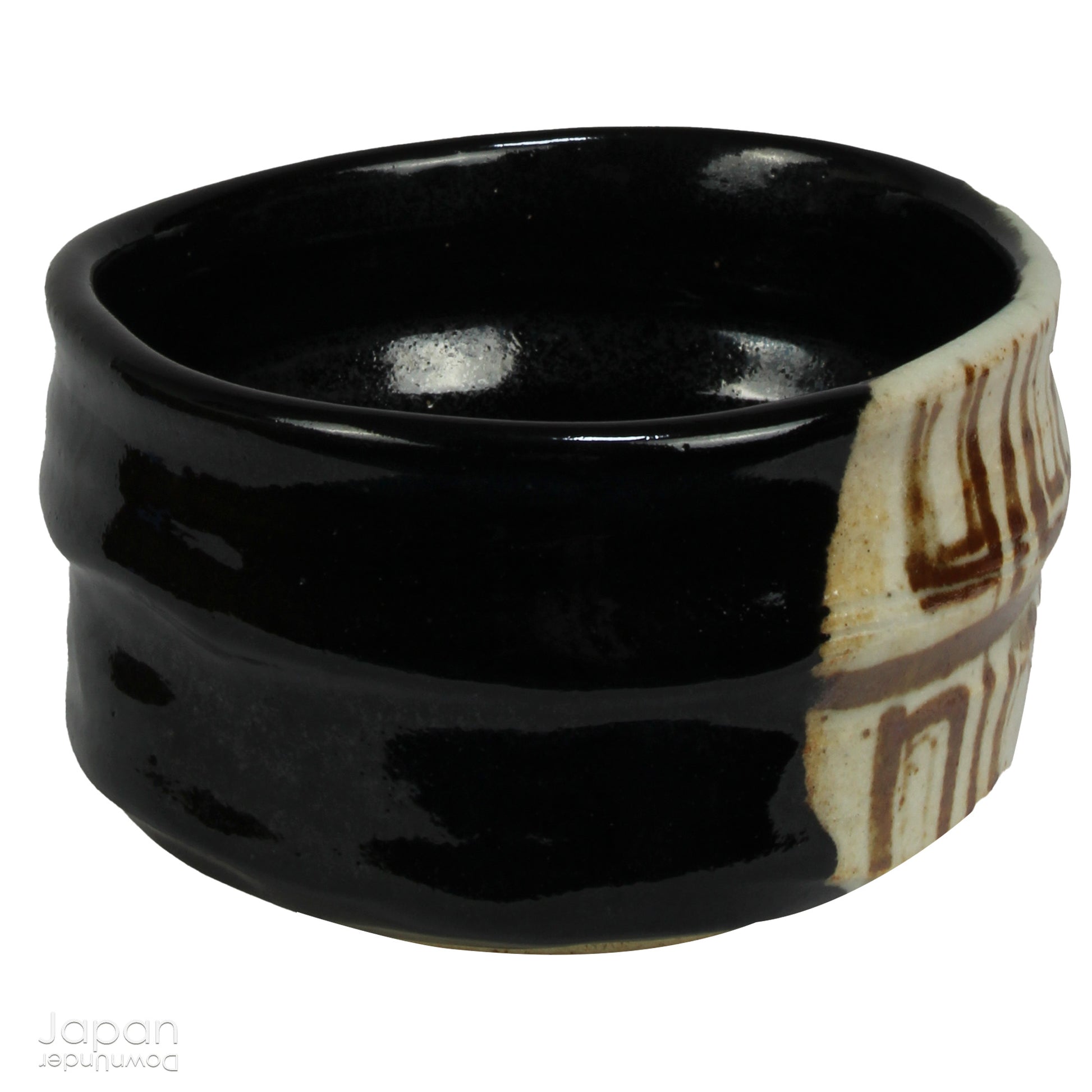 Experience the perfect blend of tradition and modernity with this stunning black Oribe matcha tea bowl. Crafted by the talented artist Yoshiyuki Sone, this unique piece boasts a contemporary design with a striking brown and beige geometric accent that adds a touch of sophistication to any tea ceremony.
The glossy black glaze of the bowl, paired with a minimalistic rectangular design, creates a striking contrast against the vibrant green matcha, making each sip feel even more special. True to the Oribe styl