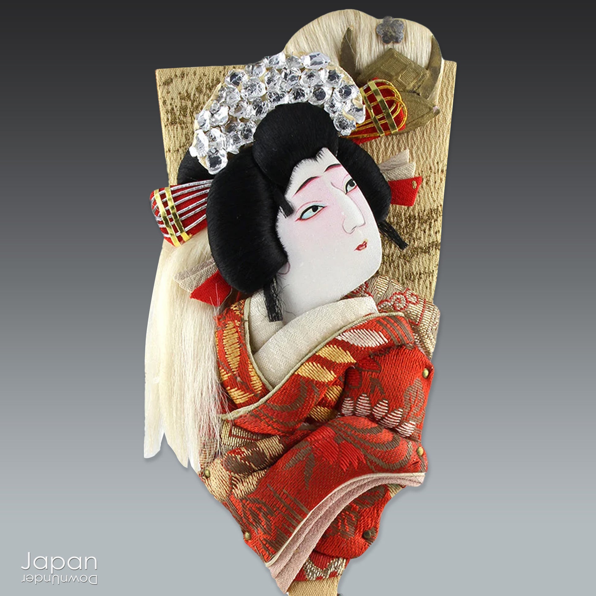 The hagoita has deep roots in Japanese New Year customs. Originally used in the game of hanetsuki - similar to badminton but played without a net - these paddles became symbolic protectors, their swift motion believed to dispel negative energy, much like the ceremonial gestures of a Shinto priest.