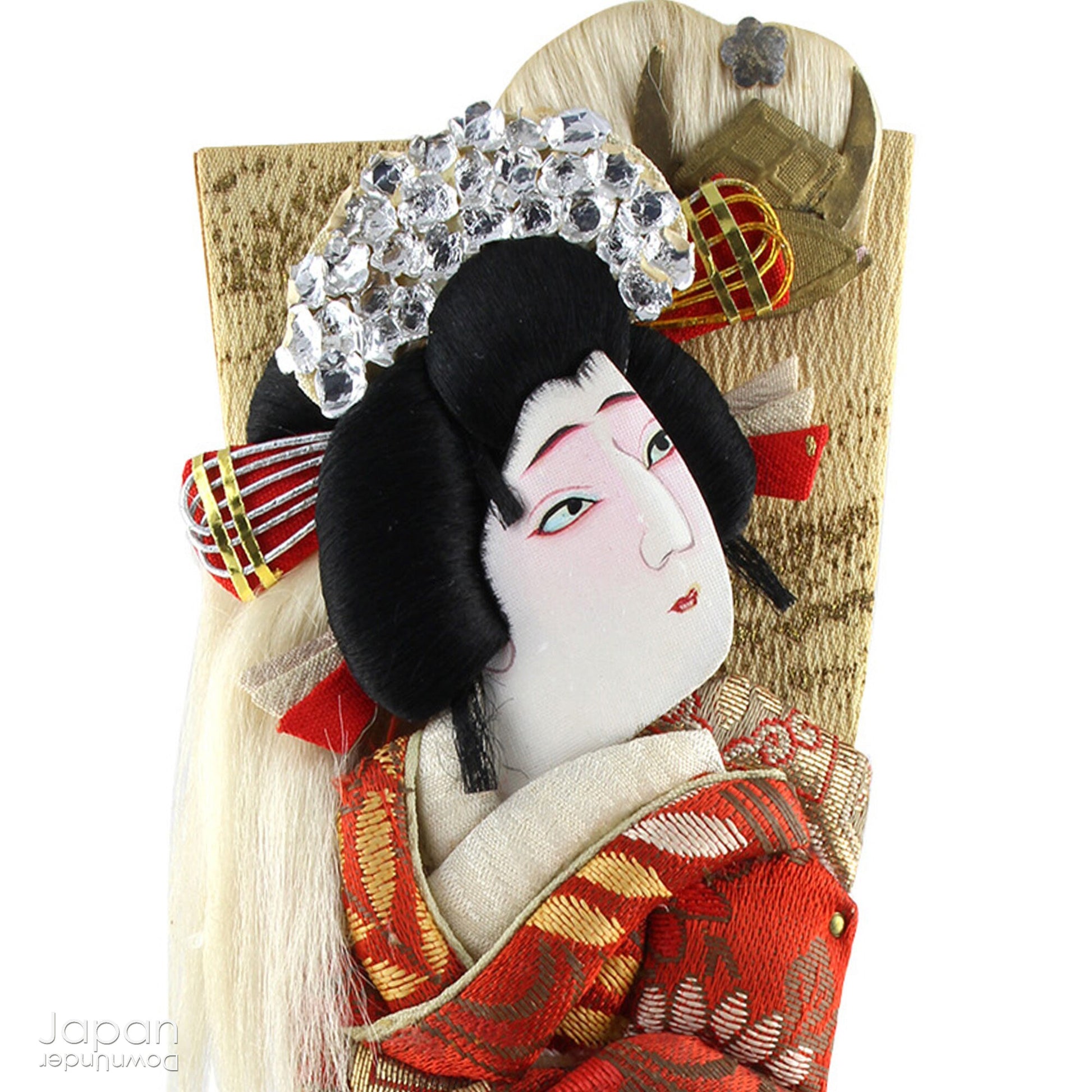 The hagoita has deep roots in Japanese New Year customs. Originally used in the game of hanetsuki - similar to badminton but played without a net - these paddles became symbolic protectors, their swift motion believed to dispel negative energy, much like the ceremonial gestures of a Shinto priest.