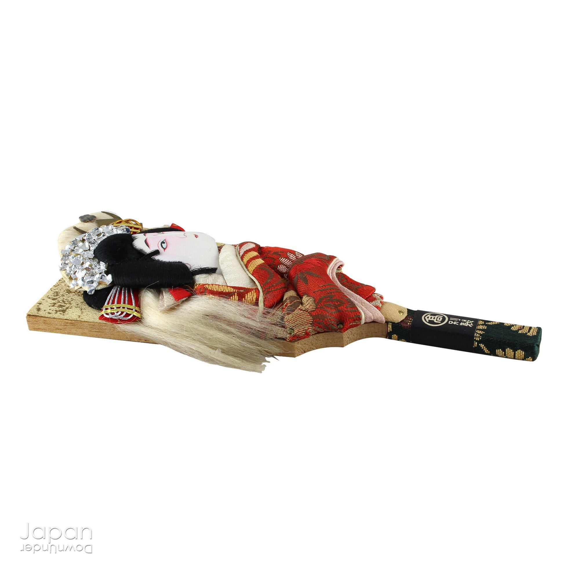 The hagoita has deep roots in Japanese New Year customs. Originally used in the game of hanetsuki - similar to badminton but played without a net - these paddles became symbolic protectors, their swift motion believed to dispel negative energy, much like the ceremonial gestures of a Shinto priest.