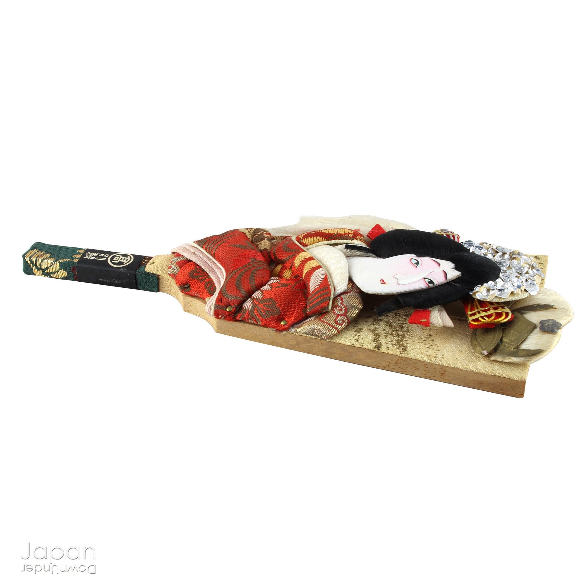 The hagoita has deep roots in Japanese New Year customs. Originally used in the game of hanetsuki - similar to badminton but played without a net - these paddles became symbolic protectors, their swift motion believed to dispel negative energy, much like the ceremonial gestures of a Shinto priest.