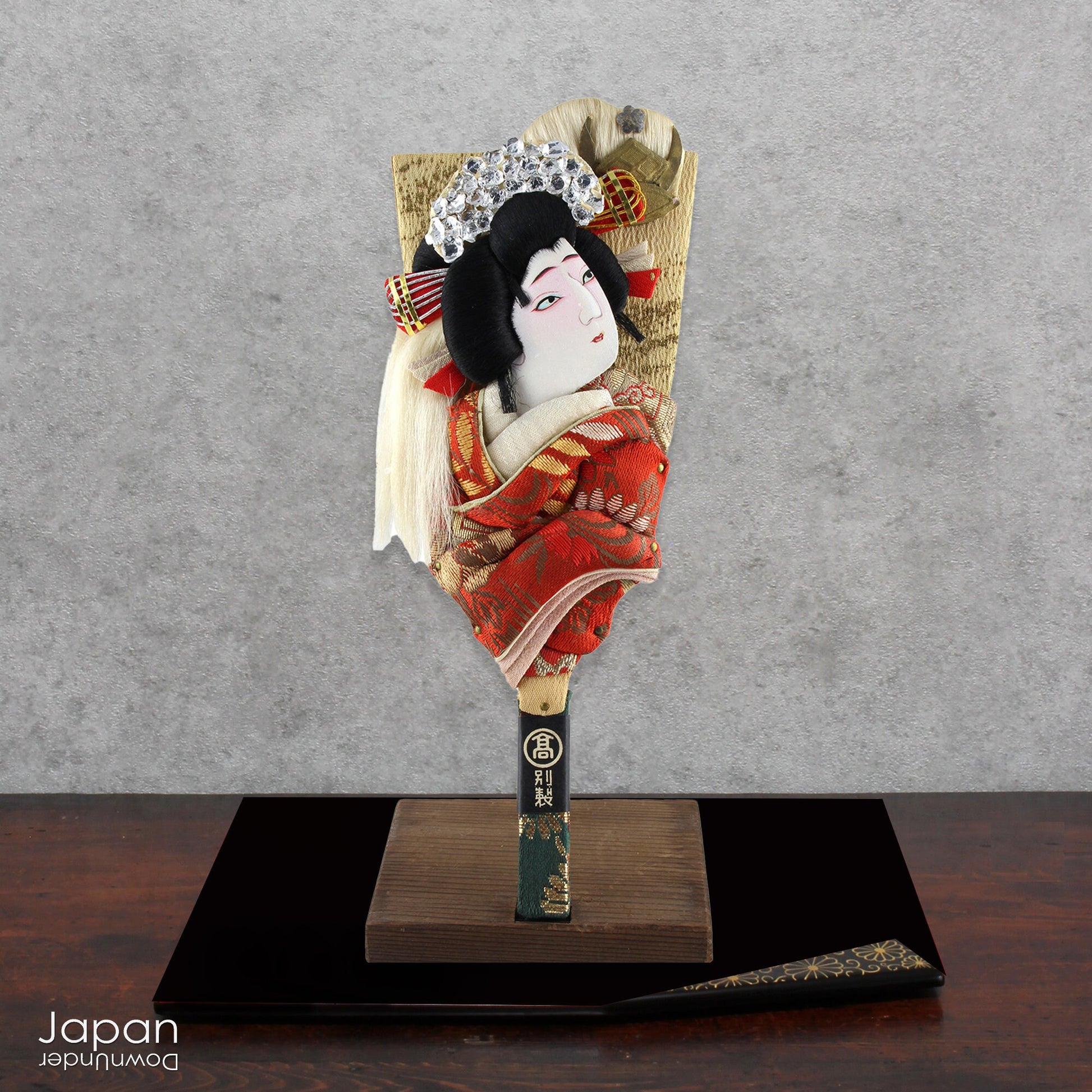 The hagoita has deep roots in Japanese New Year customs. Originally used in the game of hanetsuki - similar to badminton but played without a net - these paddles became symbolic protectors, their swift motion believed to dispel negative energy, much like the ceremonial gestures of a Shinto priest.