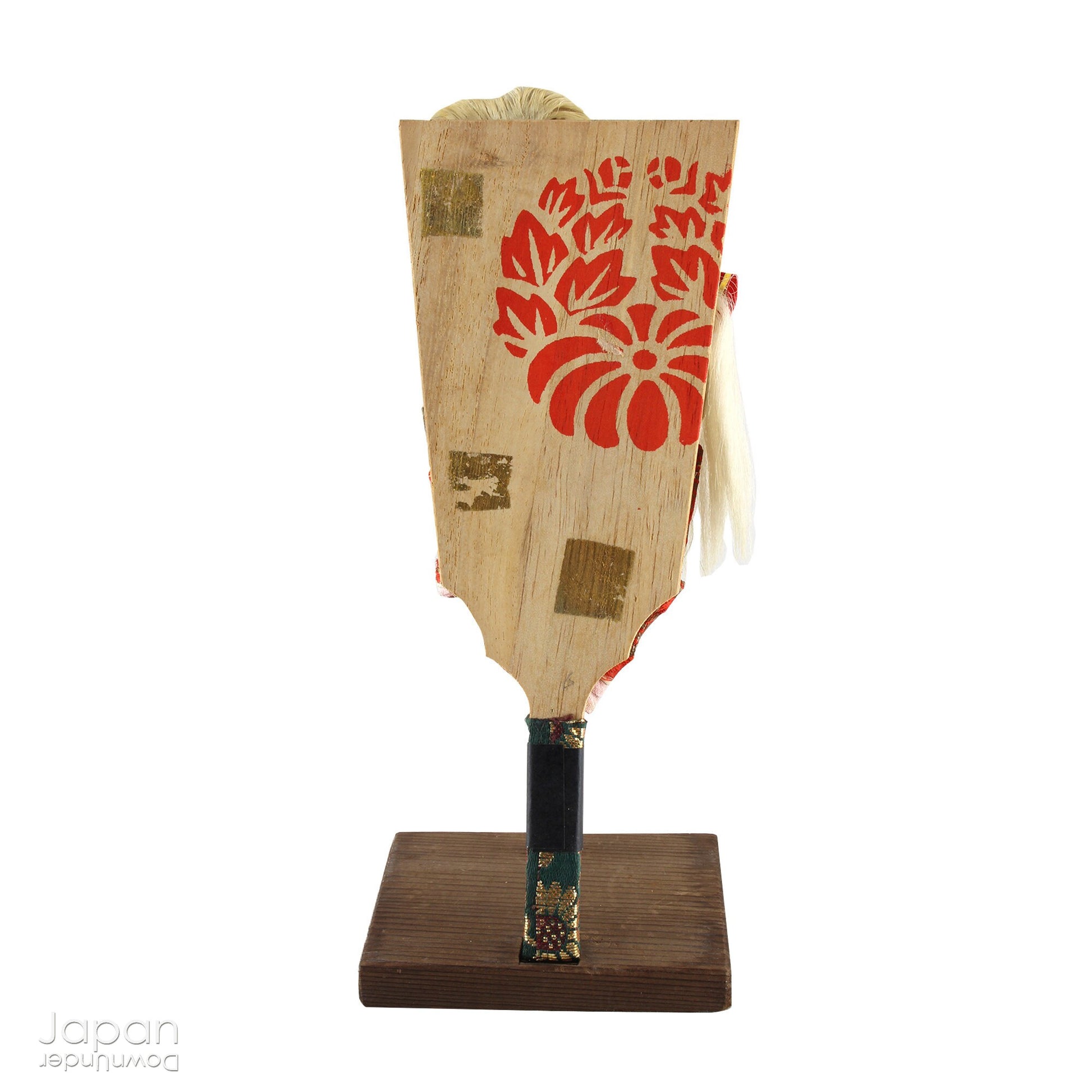 The hagoita has deep roots in Japanese New Year customs. Originally used in the game of hanetsuki - similar to badminton but played without a net - these paddles became symbolic protectors, their swift motion believed to dispel negative energy, much like the ceremonial gestures of a Shinto priest.