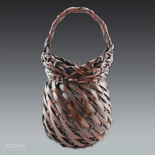 Celebrate the beauty of tradition with this exquisite vintage Japanese woven bamboo flower arrangement basket. Handcrafted from thick, durable strips of bamboo, this basket is both solid and gracefully designed - perfect for displaying your favorite seasonal blooms or simply enjoying as a striking work of art.