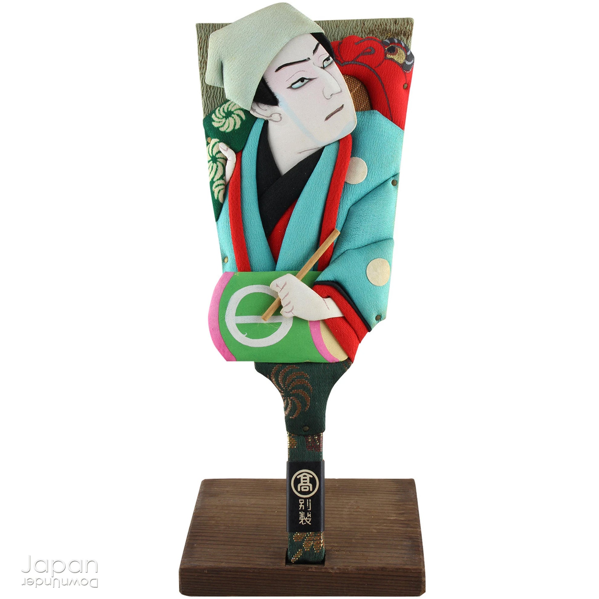 The hagoita has deep roots in Japanese New Year customs. Originally used in the game of hanetsuki - similar to badminton but played without a net - these paddles became symbolic protectors, their swift motion believed to dispel negative energy, much like the ceremonial gestures of a Shinto priest.