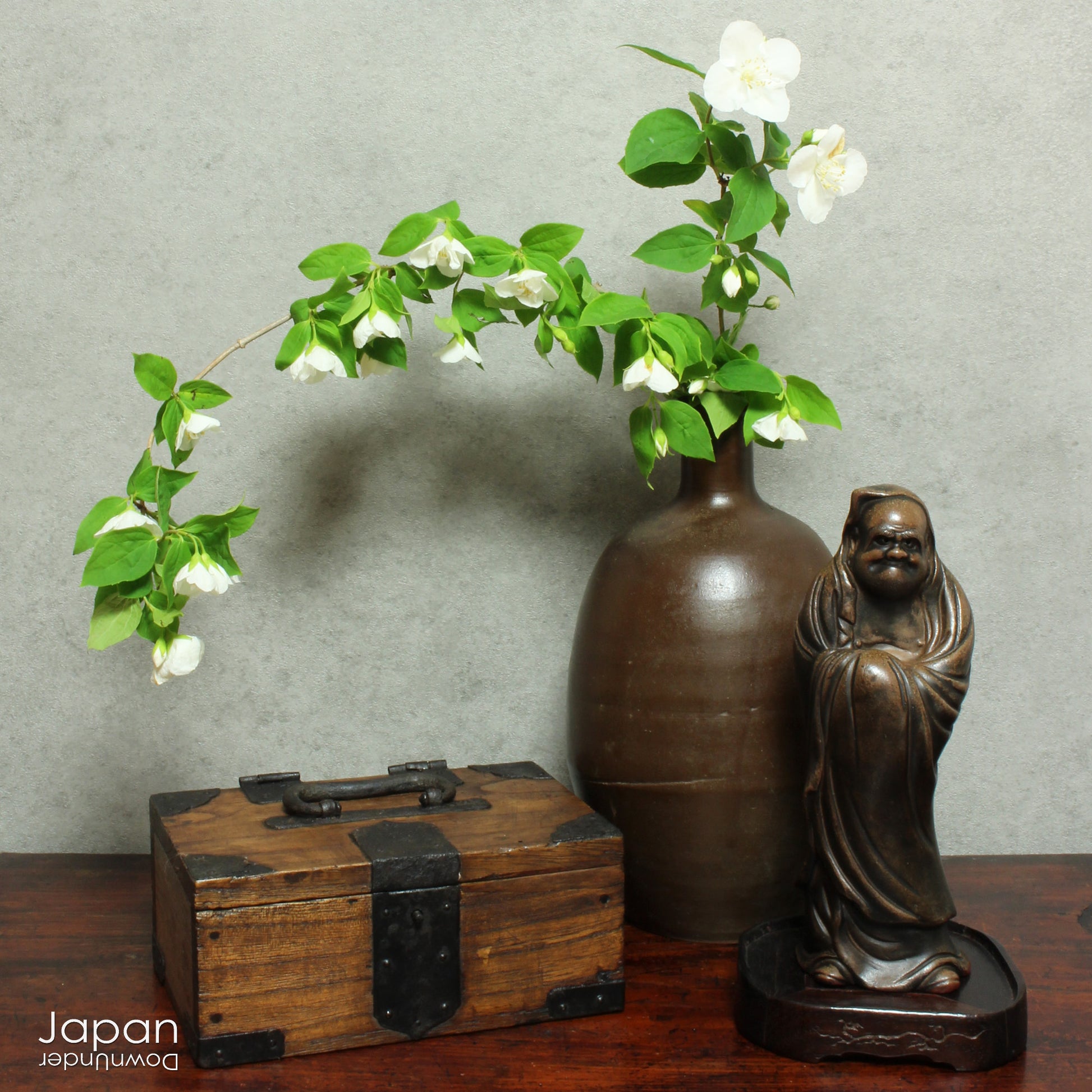 Discover the understated beauty of this Meiji era, small Japanese wooden box, a piece that effortlessly blends rustic simplicity with practical elegance. Perfect for storing your cherished small items, it adds a subtle touch of folk art to any space while offering a unique, storied storage solution.
