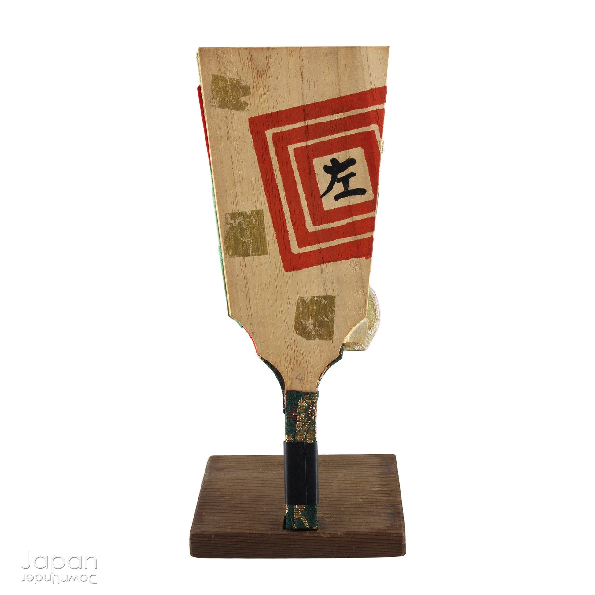 The hagoita has deep roots in Japanese New Year customs. Originally used in the game of hanetsuki - similar to badminton but played without a net - these paddles became symbolic protectors, their swift motion believed to dispel negative energy, much like the ceremonial gestures of a Shinto priest.