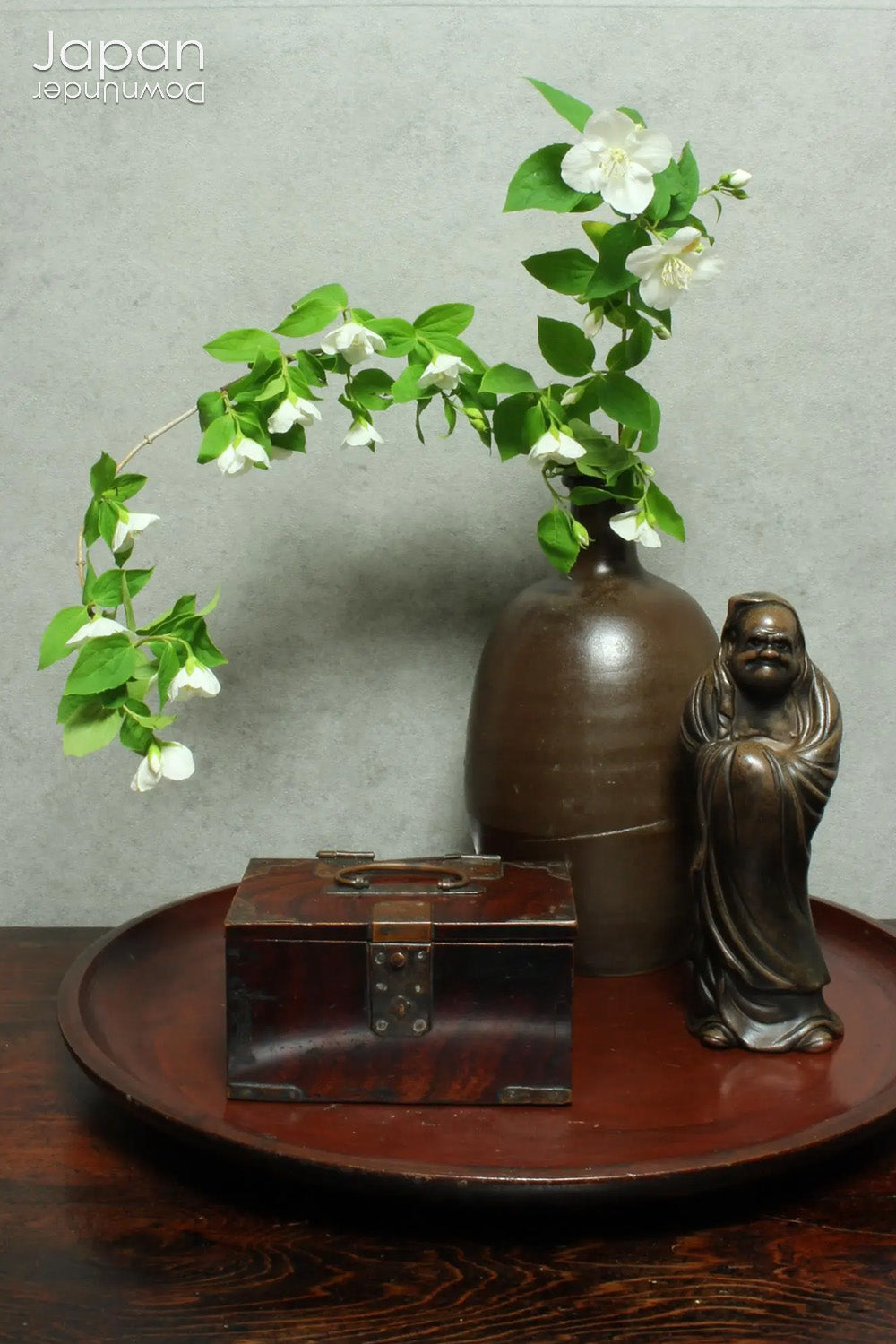 Discover a rare and beautifully aged treasure from the Meiji era (late 1800s) - a small Japanese wooden box that perfectly marries rustic charm with quiet sophistication. Originally designed with purpose and practicality at its core, this piece offers both functional storage and an understated aesthetic appeal, making it an ideal home for your cherished keepsakes or a striking accent in any space.