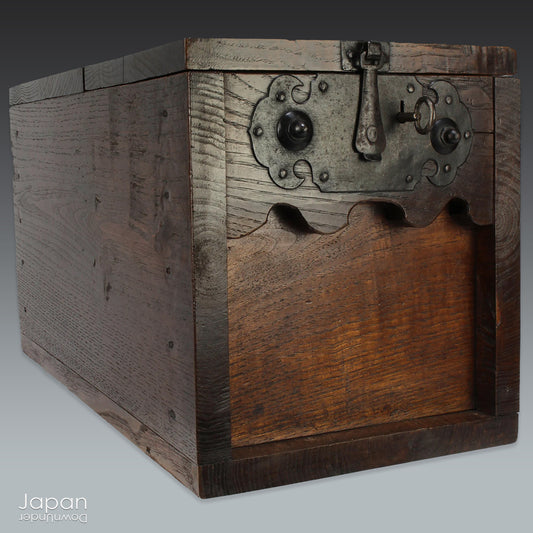Add a timeless touch of Japanese heritage to your space with this stunning, handcrafted money box from the 1800s. A truly rare find, this large zeni bako was once used by merchants during the Edo period to securely store their takings, offering both historical significance and rustic charm.