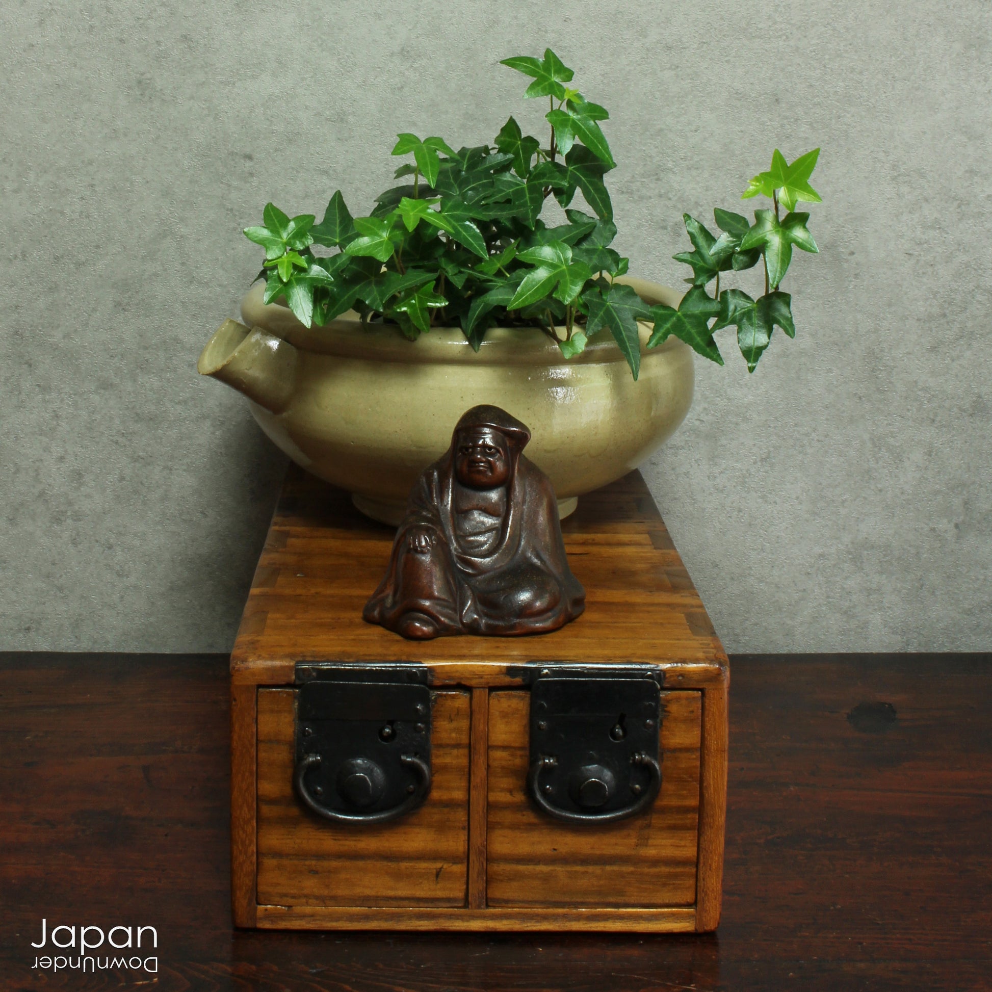Add a touch of history and heritage to your desk with this antique Japanese medicine chest -  a beautifully rustic piece that blends traditional folk art with everyday functionality. Once used in a centuries-old system of home-based healthcare, this small storage box now offers a unique and charming way to organize your workspace.