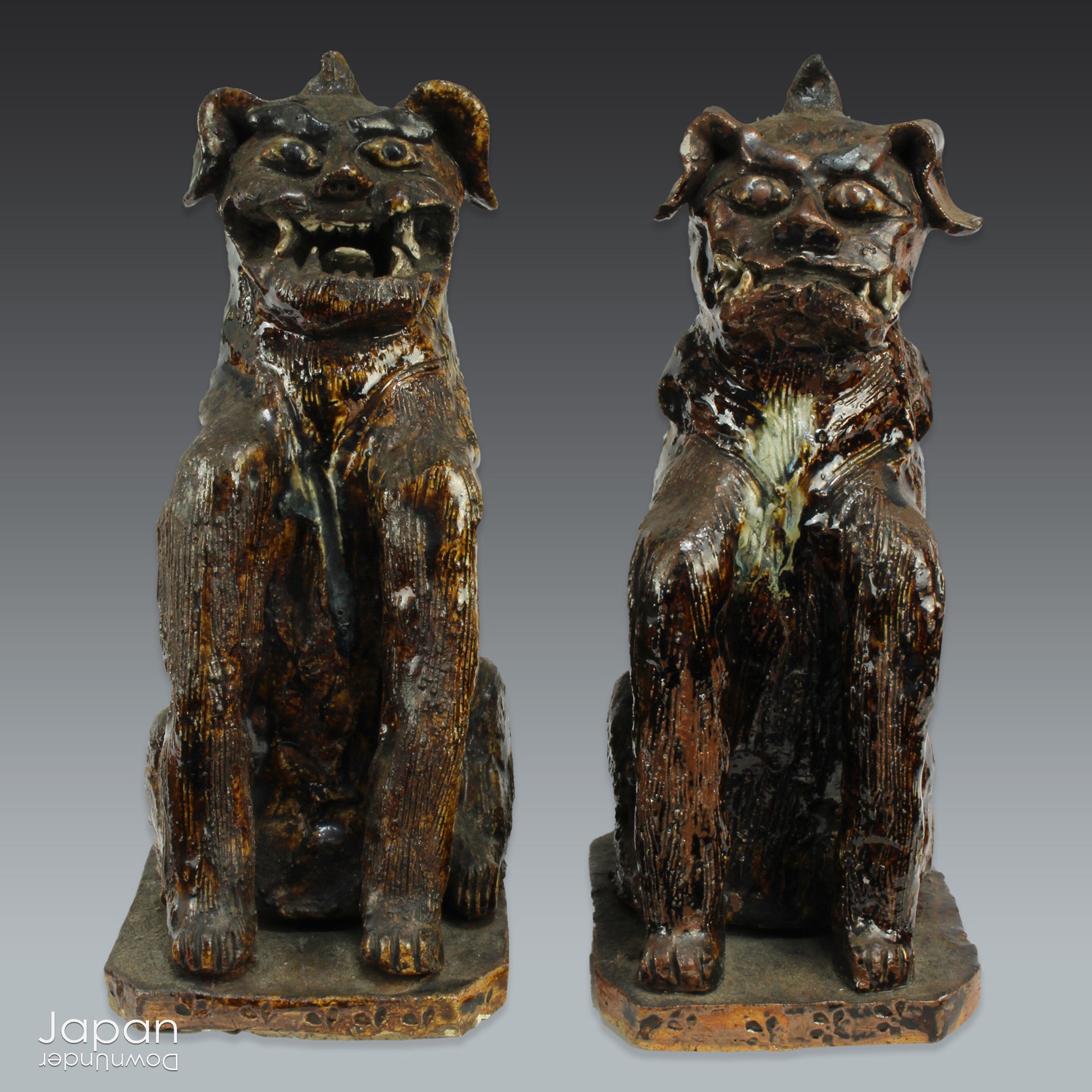 An enchanting duo of antique stoneware lion dogs, known as komainu. Believed to ward off evil, these guardians stand watch at the entrance of Shinto shrines, and will add a touch of mystique to your decor. Handcrafted with intricate details, the lion dogs are sure to bring a sense of protection and tradition to your space.