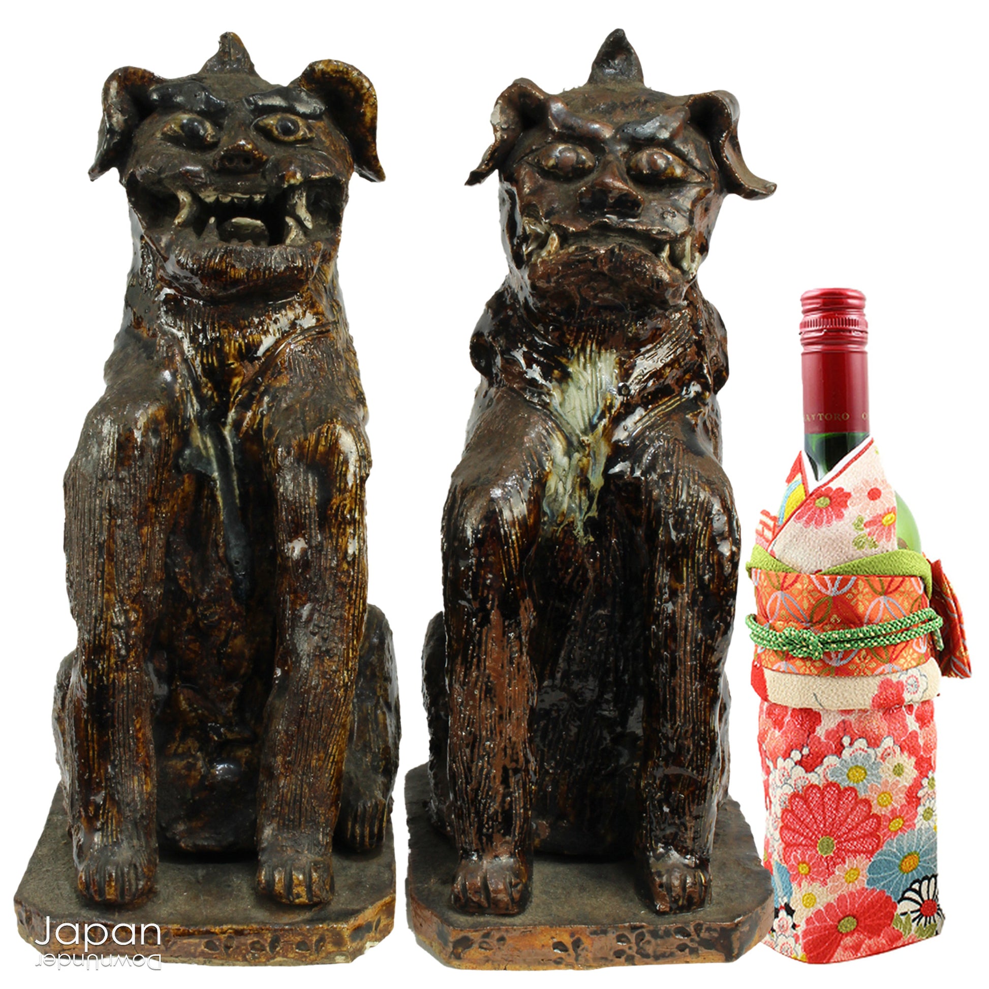 An enchanting duo of antique stoneware lion dogs, known as komainu. Believed to ward off evil, these guardians stand watch at the entrance of Shinto shrines, and will add a touch of mystique to your decor. Handcrafted with intricate details, the lion dogs are sure to bring a sense of protection and tradition to your space.
