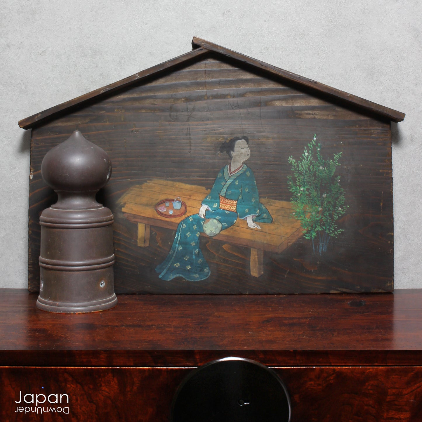 A wonderful 1800’s folk art painting featuring a Japanese woman in kimono on a very large Japanese ema. Originally a donation to a shrine, this unique piece captures the beauty and tradition of Japanese culture adding historical charm to any space.