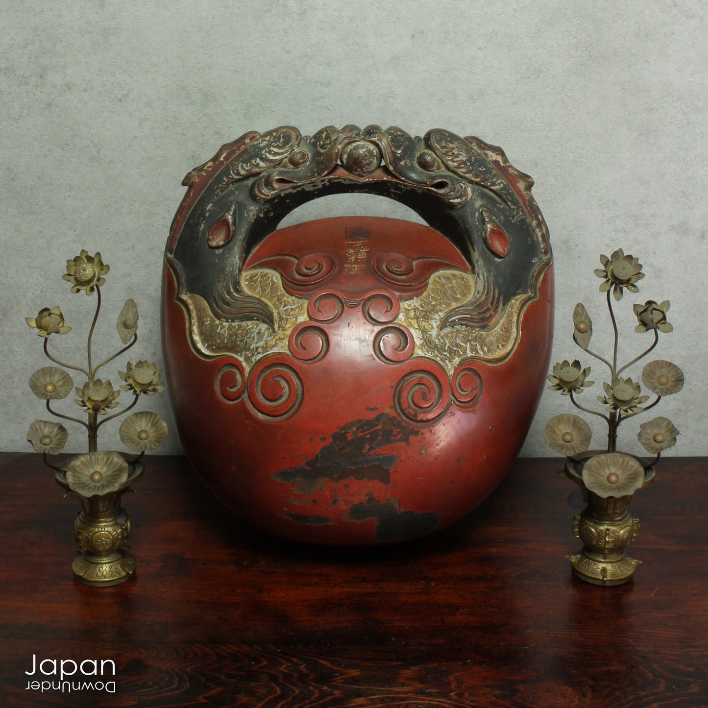 Infuse your home with serenity and grace with this exquisite pair of antique Buddhist lotus flower altar arrangements. These meticulously crafted metal flowers, known as Jouka, meaning "eternal flowers,” are a stunning representation of spiritual beauty. Set in decorative vases, these unique pieces offer a tranquil energy that will elevate any room.