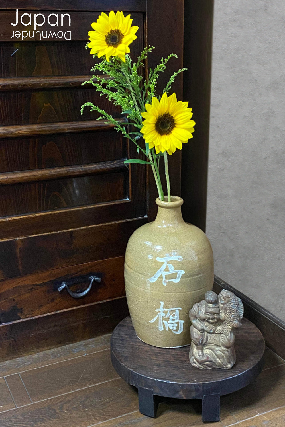 Uncover the charm and eco-conscious history of this 1900s vintage stoneware sake bottle, a one-of-a-kind treasure once used for both the purchase and storage of sake. Perfect for sake enthusiasts, collectors, or anyone looking to add a unique and sustainable piece to their collection, this bottle is a rare find that won’t last long!