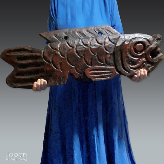 Transform your space with the beauty and history of this remarkable extra-large wooden Buddhist fish drum, a stunning piece that effortlessly blends rustic elegance with spiritual significance. Handcrafted with precision and care, this drum serves as a striking religious accent, perfect for any space with a touch of serenity and cultural depth.