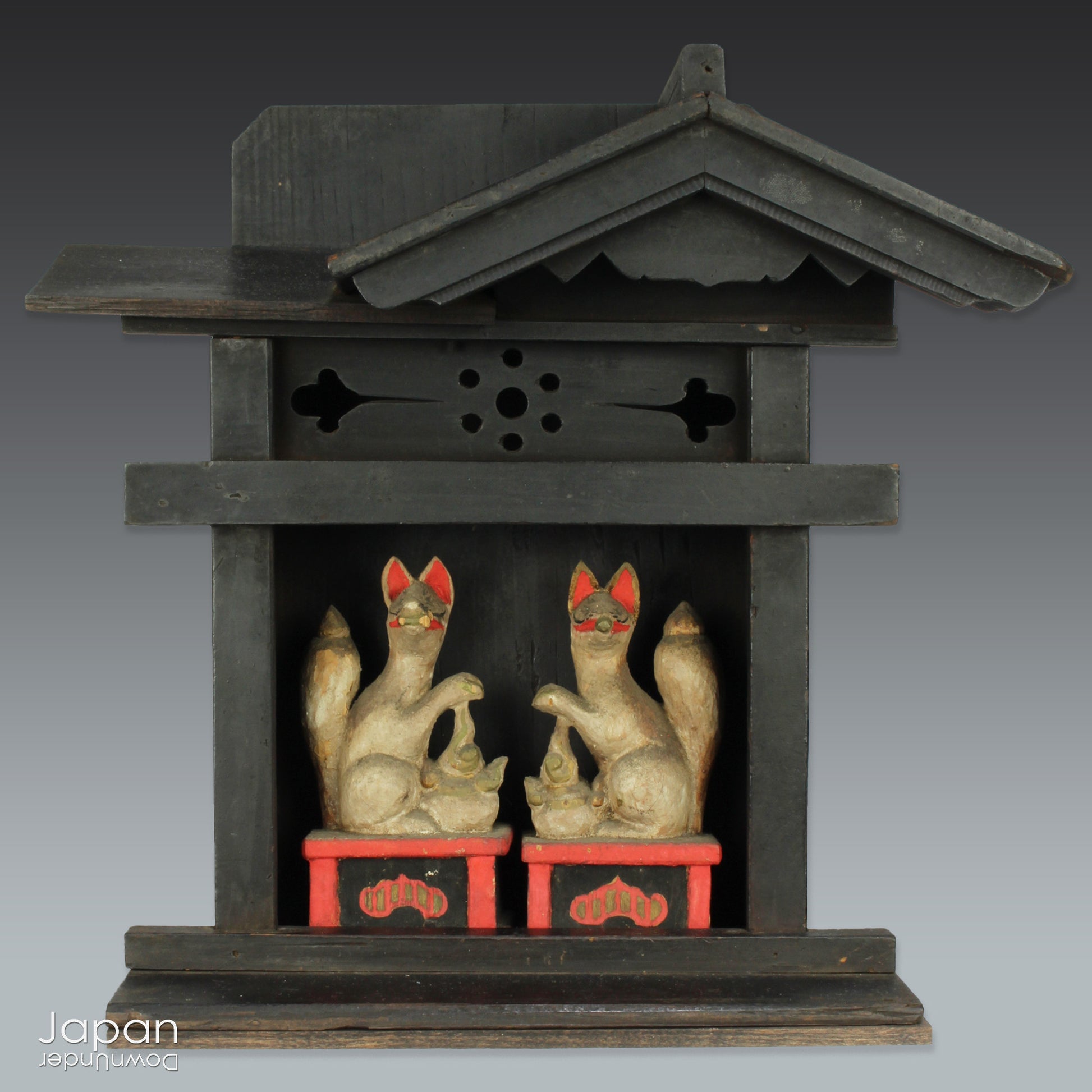 This charming Edo-period Shinto shrine is a rare and beautiful find - an authentic piece once cherished in a traditional Japanese country home. It originally held pride of place on the kamidana (god shelf), serving as a sacred site for daily offerings and prayers. Nestled within are a pair of hand-carved Inari foxes - protective spirits known to bring fortune, fertility, and blessings.