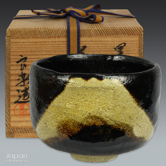 Transform your tea ritual into a refined experience with this stunning vintage black raku ware matcha tea bowl, elegantly adorned with a timeless image of the revered Mt. Fuji. The vibrant green of matcha tea beautifully contrasts against the glossy black finish of this handcrafted piece, bringing a touch of sophistication to any tea ceremony.
Handcrafted with meticulous care, this chawan is a true work of art. It showcases a serene depiction of Mt. Fuji, rendered in soft beige and brown tones that gracefu