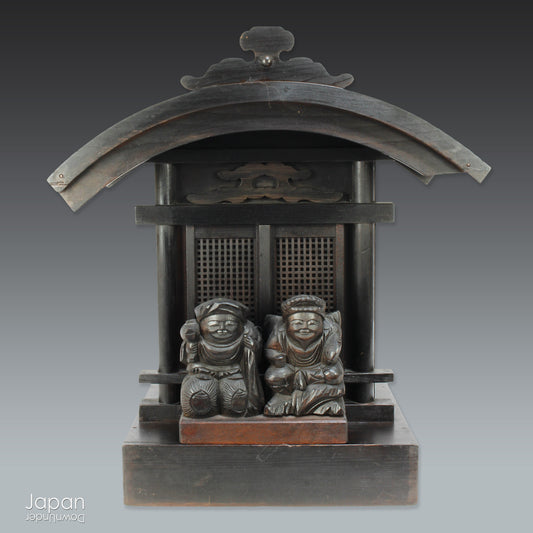 Bring a piece of history into your home with this 1900’s Shinto folk faith shrine, perfect for creating a sacred space on your own kamidana (god shelf) or within your home. This antique religious decor features the lucky gods, Ebisu and Daikoku