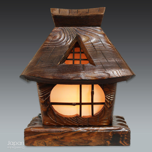 Transform your space with the tranquil charm of this exquisite vintage Japanese sugi wood table lamp, inspired by the serene beauty of mountain huts. Crafted from premium Akita sugi wood, this lamp perfectly blends rustic elegance with the warmth of nature, creating a peaceful atmosphere in any room. Ideal for cozy living rooms, serene mountain retreats, or as a unique statement piece, its soft glow invites comfort and calm.