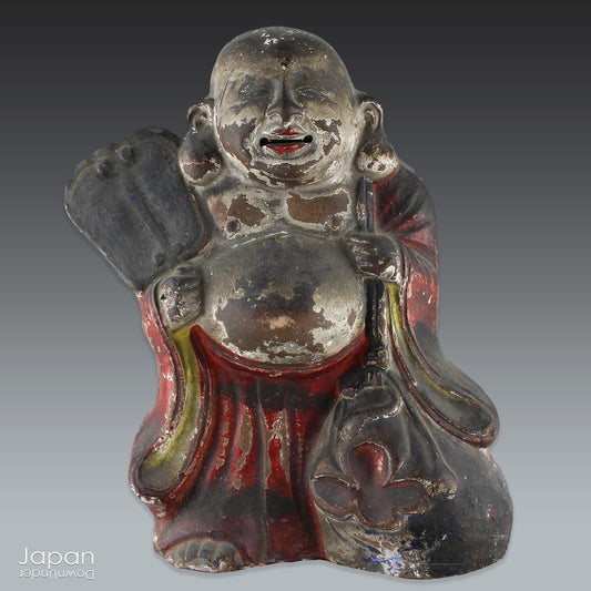 A wonderful piece of history, this charming 1800’s clay doll, shaped as Hotei, is the god of contentment and happiness and the guardian of children. This unique Shinto amulet is a rare find, adding a touch of whimsy and protection to your home.