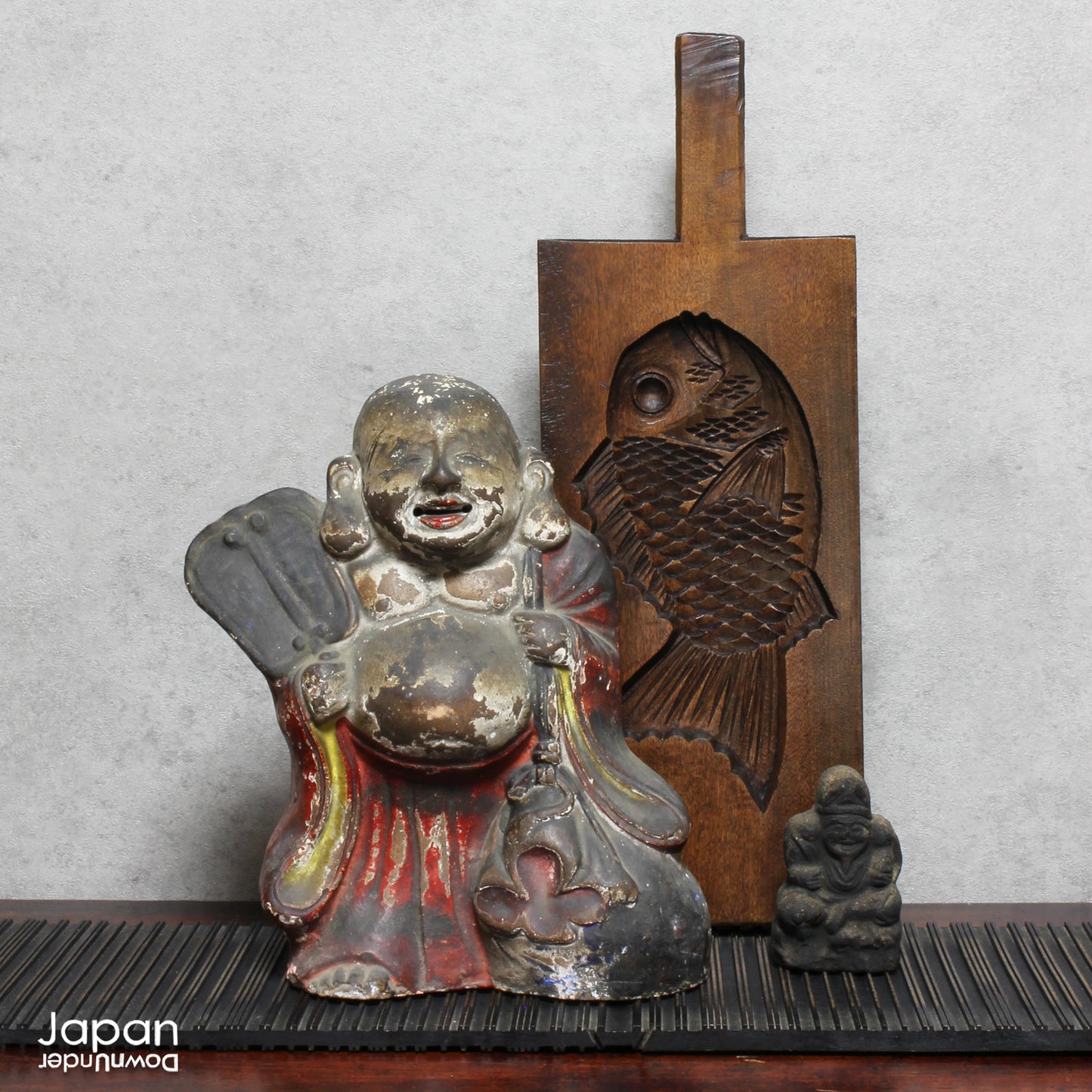 A wonderful piece of history, this charming 1800’s clay doll, shaped as Hotei, is the god of contentment and happiness and the guardian of children. This unique Shinto amulet is a rare find, adding a touch of whimsy and protection to your home.