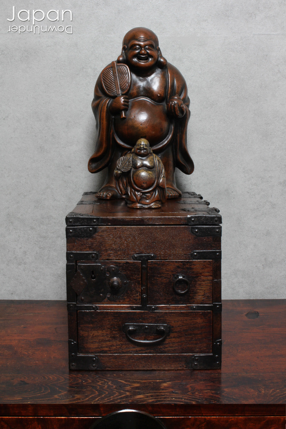 Step into the elegance of Japanese craftsmanship with this remarkable Meiji-era Bizen Hotei god sculpture. This rare treasure, with its understated yet powerful presence, invites the spirit of ancient Japanese artistry into your space. Whether you're an avid art collector, a lover of history, or simply someone who treasures the beauty of authentic craftsmanship, this piece offers a perfect blend of art, culture, and symbolism.