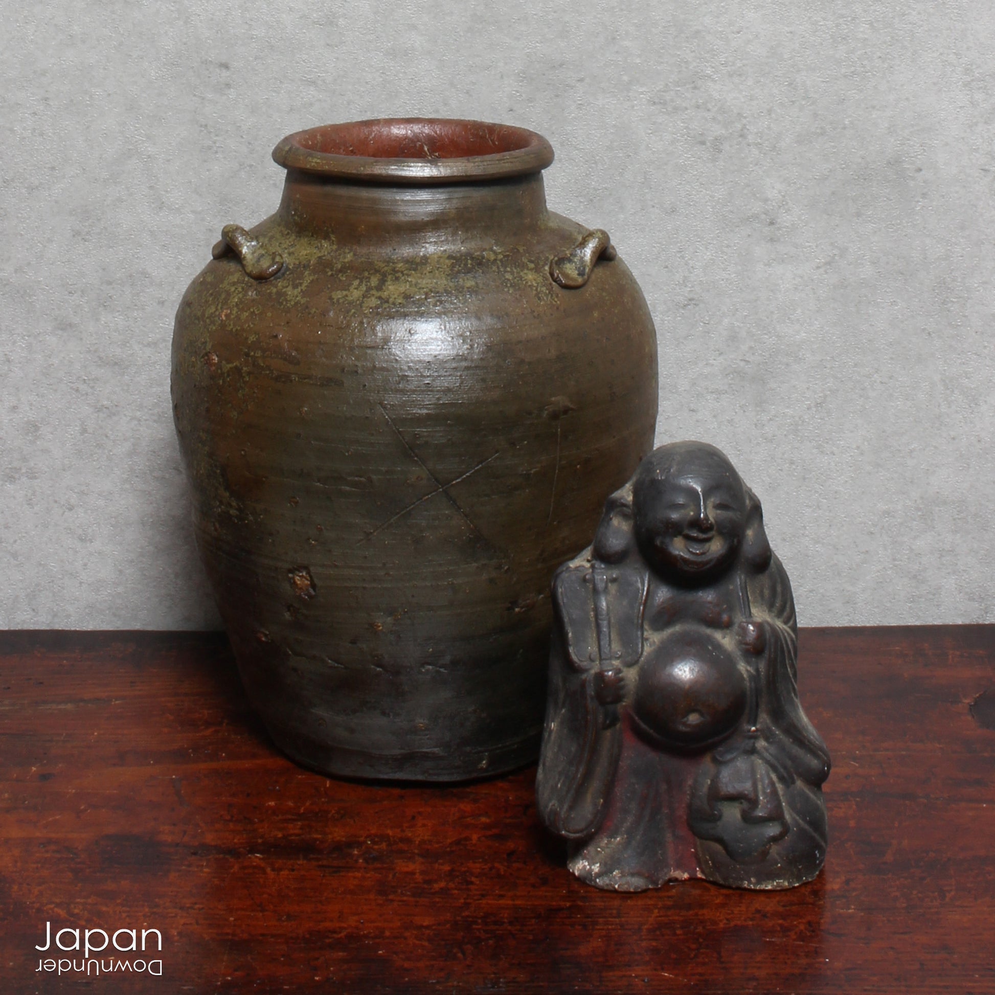 This handcrafted antique Bizen vase brings a serene, soulful presence to any interior. With its earthy tones and rustic textures, it offers more than simple decoration - it tells a story woven through centuries of Japanese heritage.