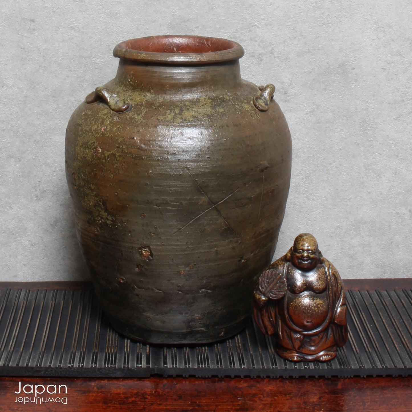 This handcrafted antique Bizen vase brings a serene, soulful presence to any interior. With its earthy tones and rustic textures, it offers more than simple decoration - it tells a story woven through centuries of Japanese heritage.