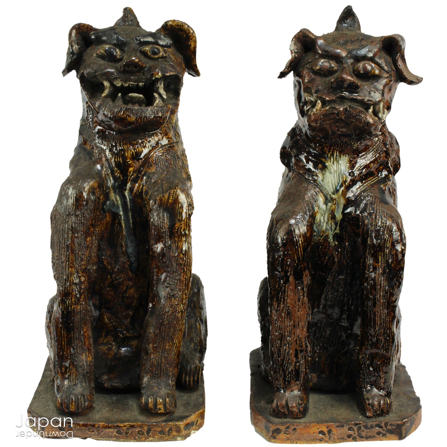 An enchanting duo of antique stoneware lion dogs, known as komainu. Believed to ward off evil, these guardians stand watch at the entrance of Shinto shrines, and will add a touch of mystique to your decor. Handcrafted with intricate details, the lion dogs are sure to bring a sense of protection and tradition to your space.