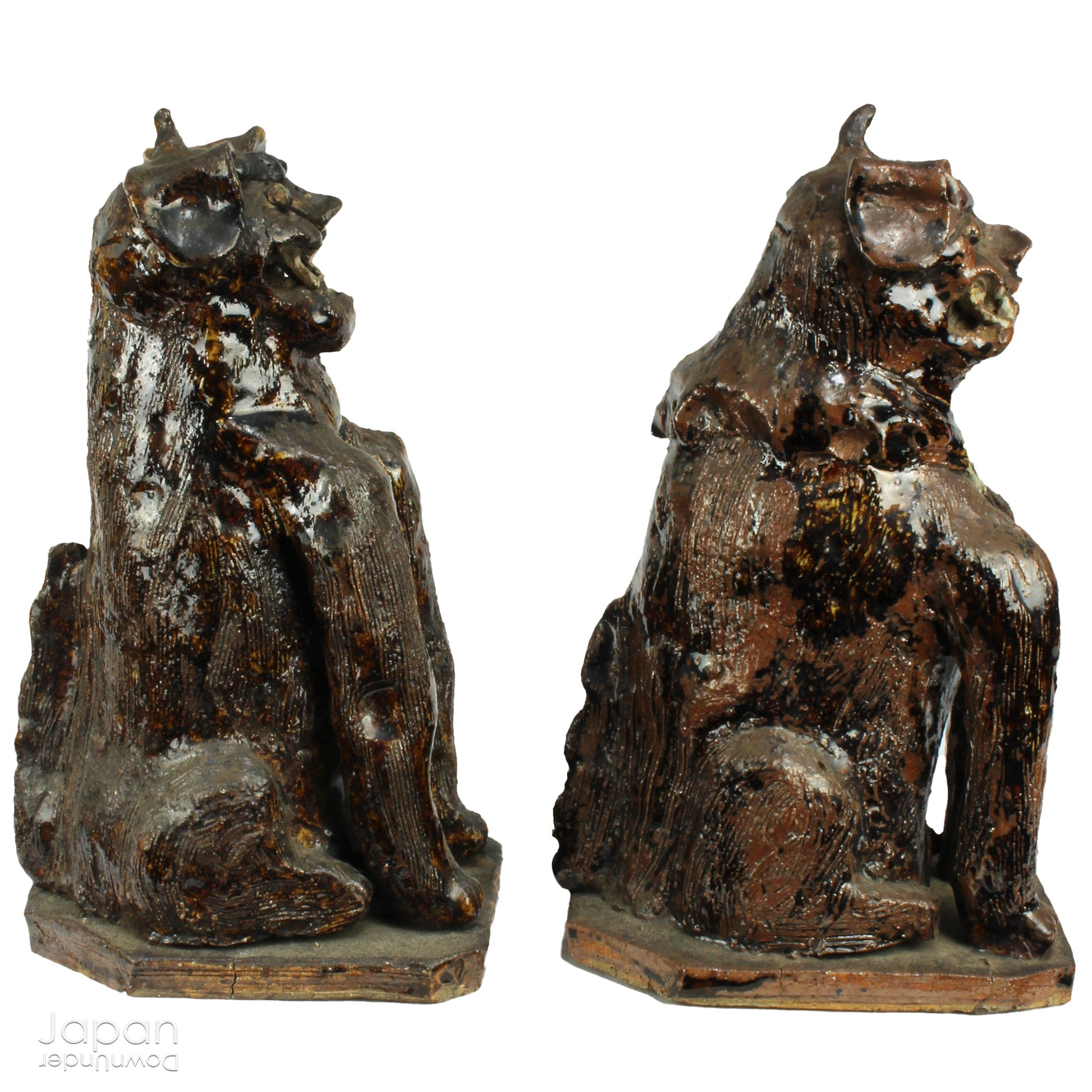 An enchanting duo of antique stoneware lion dogs, known as komainu. Believed to ward off evil, these guardians stand watch at the entrance of Shinto shrines, and will add a touch of mystique to your decor. Handcrafted with intricate details, the lion dogs are sure to bring a sense of protection and tradition to your space.